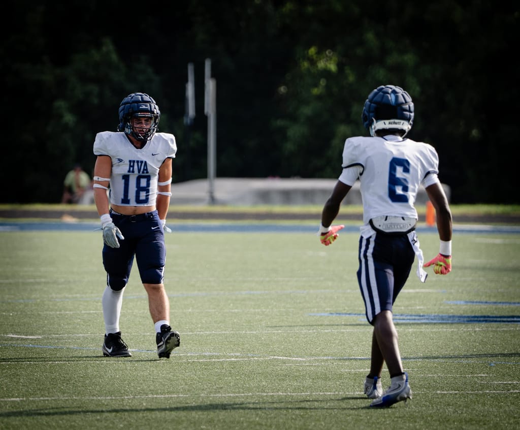 Two players facing each other between plays
