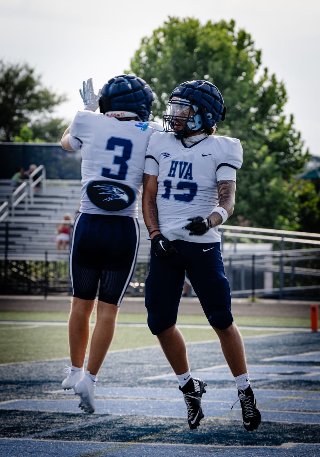 Two players celebrating together in the end zone