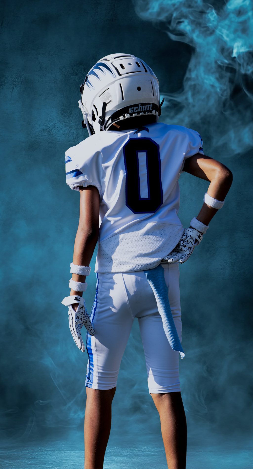 Young player standing, studio-lit composite