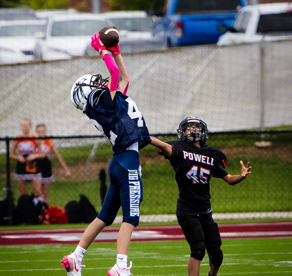 Player rising for a catch over a defender